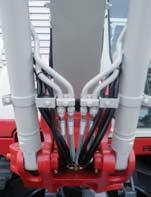 Dual boom cylinders with hose burst check