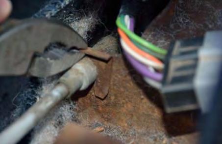 11. Remove shifter cable retaining clip. TOOL: Pliers 12.