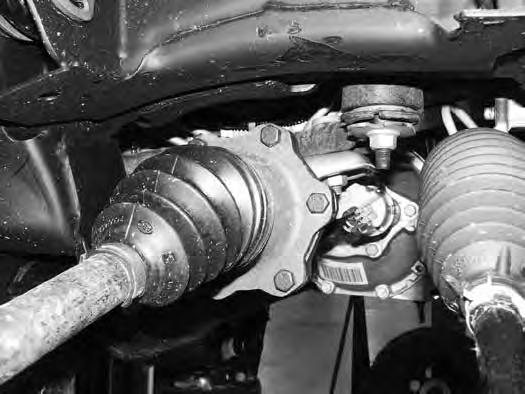 Remove the CV shaft from the hub and set aside. Remove the lower ball joint nut and remove the knuckle assembly from the lower control arm. Save ball joint nuts. 16.