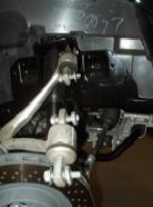 (See Photo 4) Photo 2 B) Remove the upper control arm bolts.