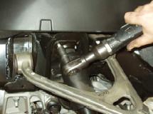 (See Photo 19) REAR SUSPENSION REMOVAL Page 7 of 11 A) Raise the suspension upwards using a floor or screw
