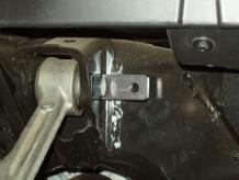 Then secure the reservoir L bracket to the forward control arm mount using the supplied bolt as shown.
