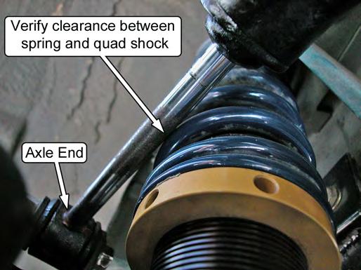 37. If the vehicle is equipped with quad shocks, verify that there is sufficient clearance between the outside of the coil-over spring and the quad shock piston rod.