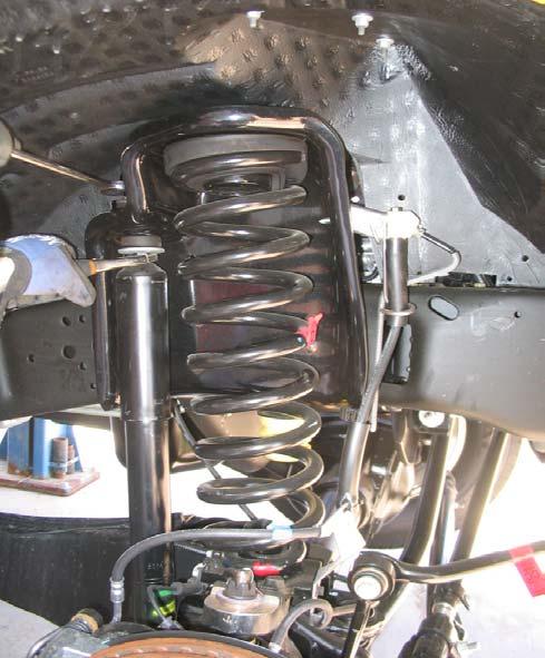 Disconnect endlinks to sway bar, brake line bracket and OE shocks (both sides). Fig.1 7. Lower the front axle as far as possible.