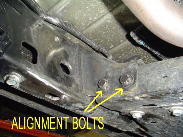 17) X FACTOR LONG ARM SYSTEMS ONLY: Remove the OEM passenger side front upper control arm mount off the axle.