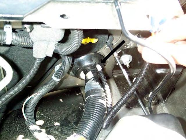 Secure any loose wiring under the dash with tie straps or electric tape and then re-install the lower kick panel.