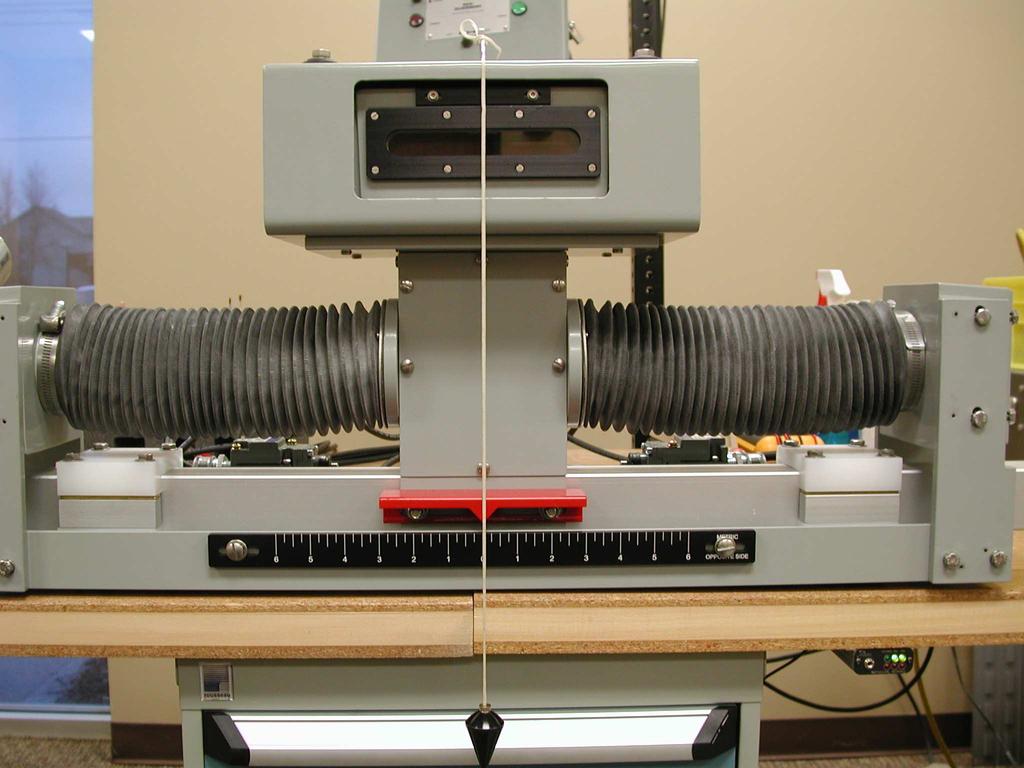 Using the mounting points for the flexible shields (indicated by the Red arrows in the picture to the left) on the servo as a reference, measure to verify that the distance on both sides is equal.