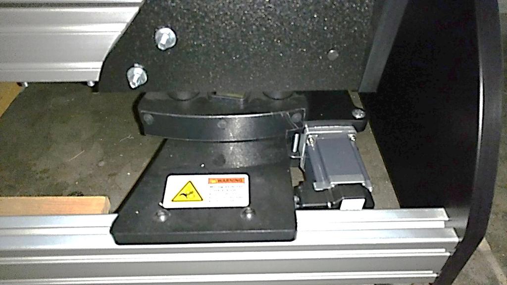 Install finger guards at all four rollers as shown using the screws provided. Place warning decals at all four roller platforms.