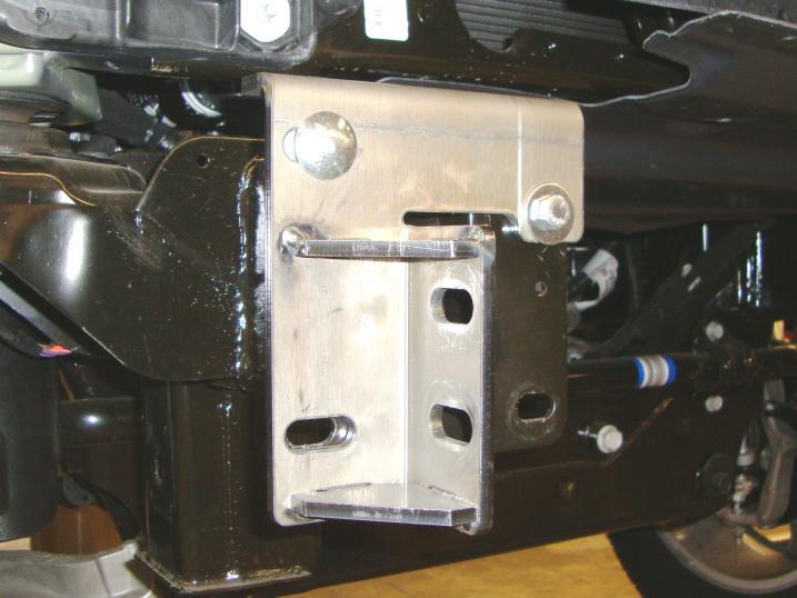 Step-9 Position the bumper replacement passenger side frame bracket up to flange on the end of the frame, align the (2) holes in the top of the frame bracket with the holes in the flange and secure