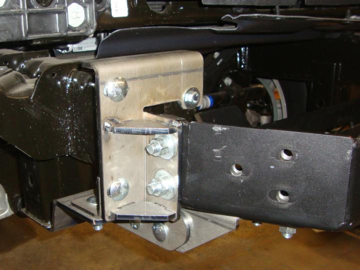 side frame brackets, and the nuts and bolts securing the mounting plate/winch tray to the frame brackets, (Photo 8).