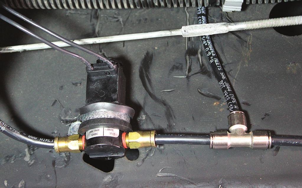 Some paint may need to be ground off the frame to make good contact. fig. B.2 Compressor The compressor air line can be installed on either side of the exhaust solenoid. fig. B.3 Exhaust solenoid CAUTION LOCATE COMPRESSOR IN DRY, PROTECTED AREA ON VEHICLE.