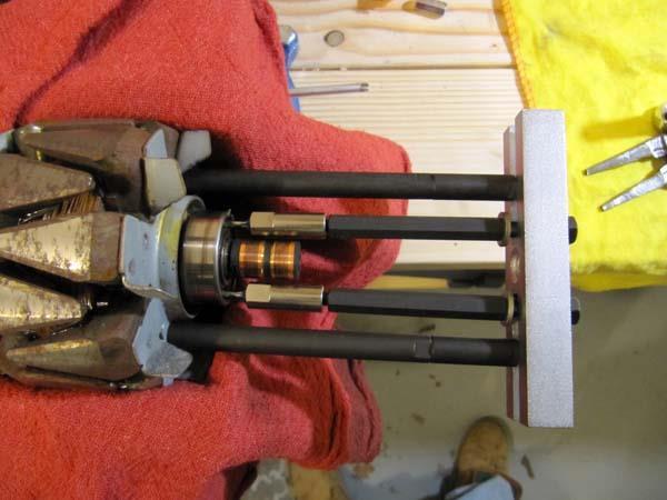 #25 The bearing can then be pulled off by tightening the puller bolts shown by