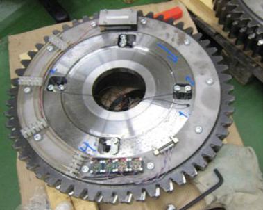 In the reference measurement, two accelerometers were mounted 180 degree out of phase on both the cam-gear and the large intermediate shaft gear, so that by taking the average of the two acceleration