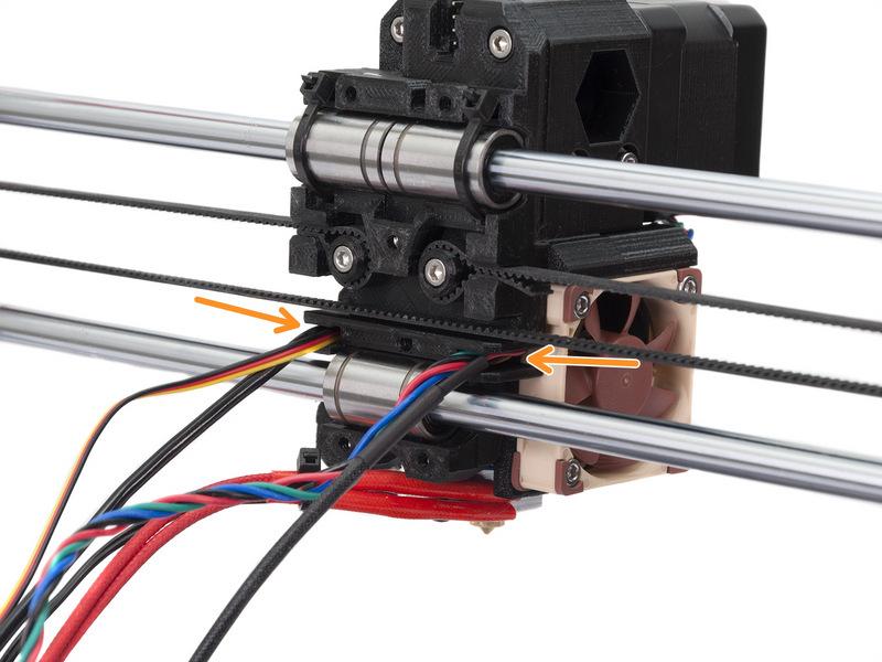 Guide the cables through slots (channels) on both sides of the Extruder. On the left side, it is Front Print fan and P.I.N.D.A.