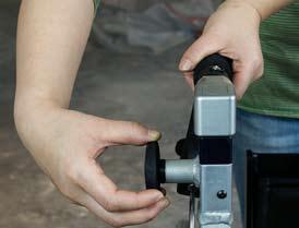 After both Handle Bar Grips are at the desired height, release the Handle Bar Locking Knobs by