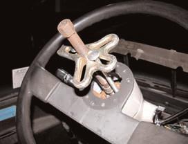 Use the steering wheel puller to pull the steering wheel.