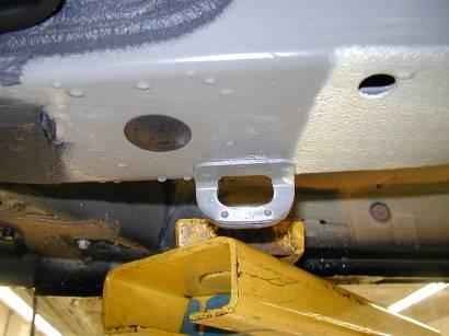 Figure 3 (front tie down slot) Figure 4 (rear tie down slot) After securing, return the
