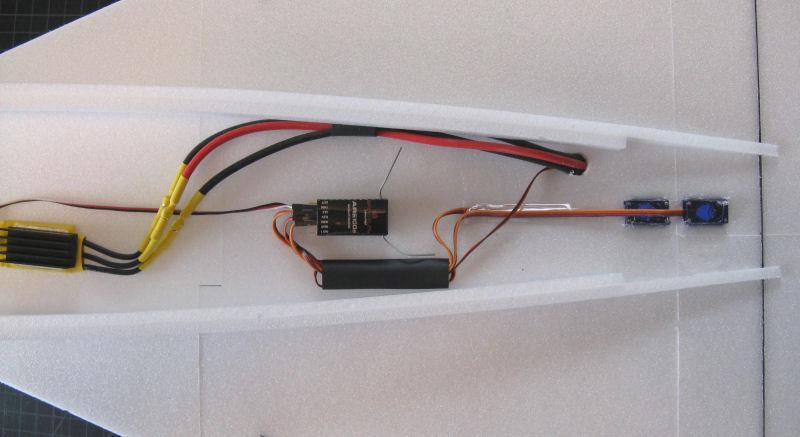 Photo above (top of wing) shows the motor extension wires coming up through the wing and attached to the ESC. The location of the RX and ESC may vary depending on the type of gear you are using.