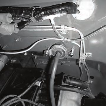 Bend or trim the mounting brackets, and relocate them to another area (See Photo 12, below). NOTE: Relocating the relays to the outer left side of the glove box is recommended. 2.
