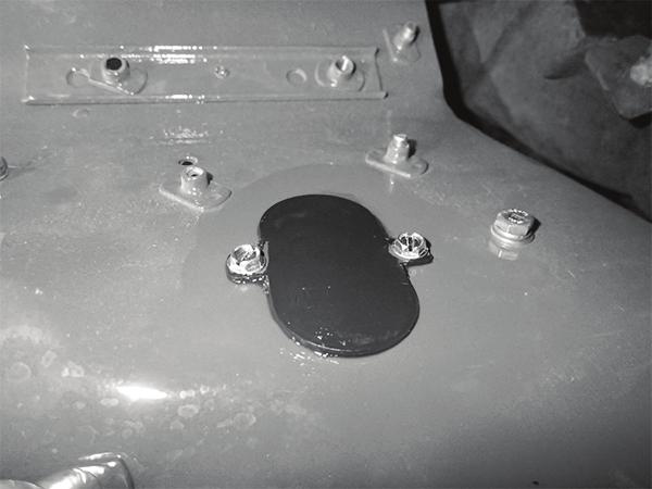 From the engine compartment, locate the weld nut on the right side of the blower assembly opening on the firewall (See Photo 18, below).