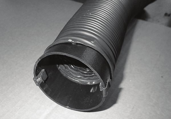 Center the hose between the blower and the heater hardlines, and tighten (See Figure 6, Page 27, and Photo 47, below).