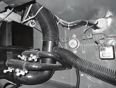 Disconnect the duct hoses from the (2) defrost ducts (See Photo 2, below). Remove the ducts along with the plastic diverters (See Photo 3, below).