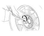 Service and Appearance Care 5-71 { CAUTION 3. Loosen the wheel nuts but do not remove them using the lug wrench.