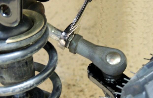 4. Adjust the tow-in by loosening the jam nut then lengthen or shorten the tie rod by turning the hex shaped rod adjustment. Shortening the tie rods increases the tow-in, lengthening decreases it. 5.
