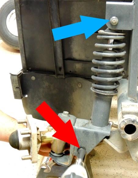Disconnect the tie-rod ends (red arrow) from the steering knuckles by removing the