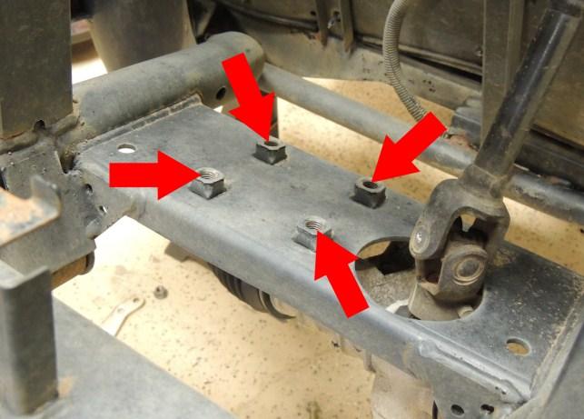 Remove the steering knuckles (blue arrows) from the spindles by removing the safety