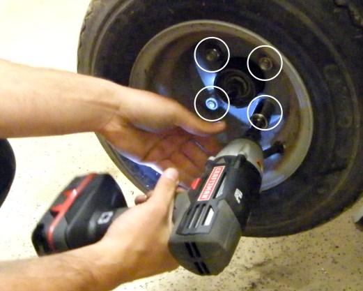 23. Install the (2) front tires. The stock tires and wheels will not work on the newly lifted cart. Fully tighten the lug nuts on both wheels.