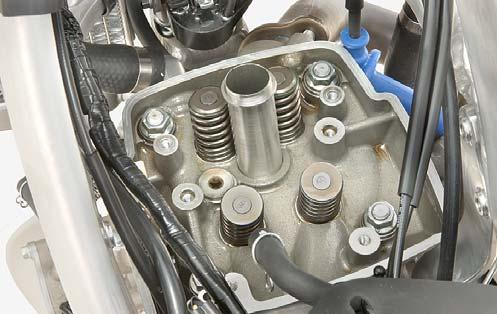 Suspend the cam chain with a piece of wire to prevent it from falling into the crankcase. 10.
