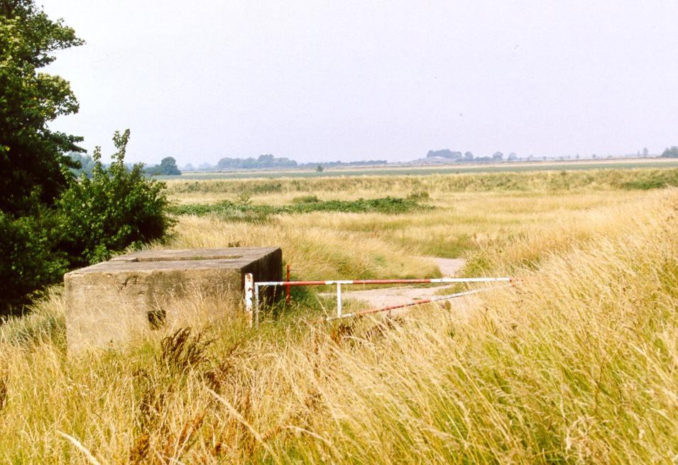 Fig. 6 - UORN 5206: Lincolnshire-type three bay infantry pillbox on the curving corner of the sea bank. The bank to the right did not exist at the time of the Second World War.