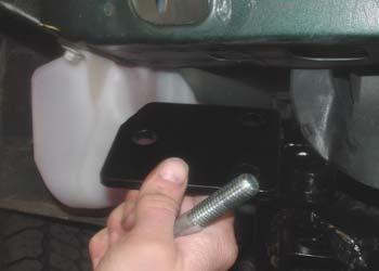 Using one of the supplied ½" x 4" bolts and nylock nuts, bolt through the