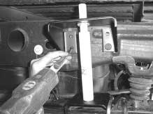 Tighten rear lower hole frame bolt securely. F Centerpunch and drill remaining two upper holes.