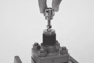 Remove the actuator mounting nut from