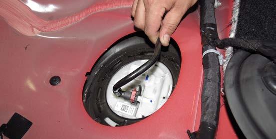 This step must be performed correctly to prevent the float from contacting the side of the fuel tank. 16.