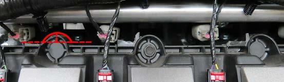 Place a rag under the passenger side heater hose and remove the heater hose