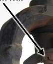 Take care not to damage axle seal that is located where the