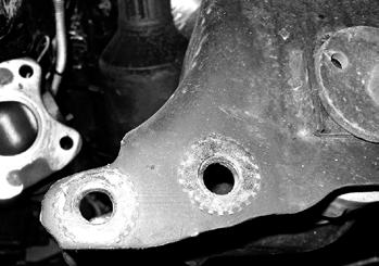31. The driver s side rear lower control arm pocket must be trimmed to provide clearance for the differential in its lowered position.