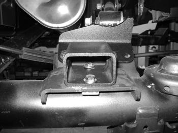 87. Attach bump stop extensions to the driver and passenger side with 3/8" x 7/8" bolts with washers into threaded plate. Tighten to 35 ft-lbs.