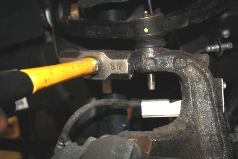 Figure 1: breaking ball joint loose from spindle 3.