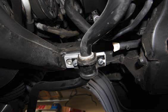 Torque the castle nut to 67 ft/lb. Insert a new cotter pin in the nut and tie rod, bend the end of the pin to hold it inplace. 18. Install swaybar spacers on the frame.