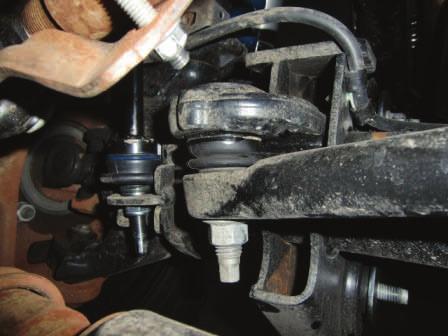 Loosen ball joint nut and