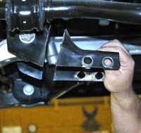 Disconnect the OEM upper & lower ball joints from the OEM steering knuckles using a 21mm socket & ball joint remover or other suitable tool. (See Photo # 5) Remove the OEM steering knuckles.