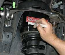 Align the previously made marks & tighten the new strut spacers to the OEM strut assemblies using a 15mm socket. (See Photo # 14) 26.