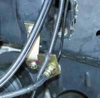 31. Remove the OEM brake line brackets from the frame rail & install the new Skyjacker drop brackets at this position. Attach the new Skyjacker drop brackets to the frame rail using the OEM hardware.