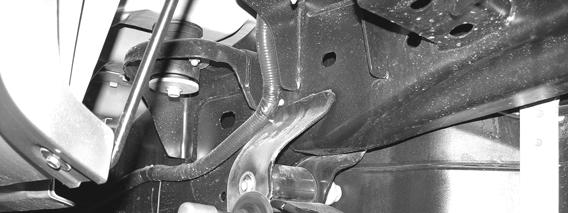 57. Locate FT30071 E-brake bracket and place it on the spring bolt and