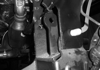 Figure 17 29. With the crossmember installed mark the differential hole on the factory control arm bracket.