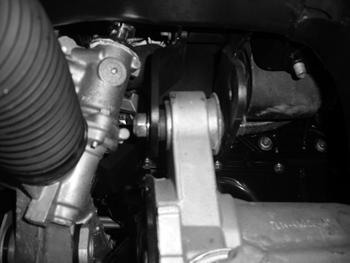 Figure 19 33. Install the new rear crossmember in the rear lower control arm frame pockets and fasten with new 18mm bolts and washers (do not put nuts on at this time).